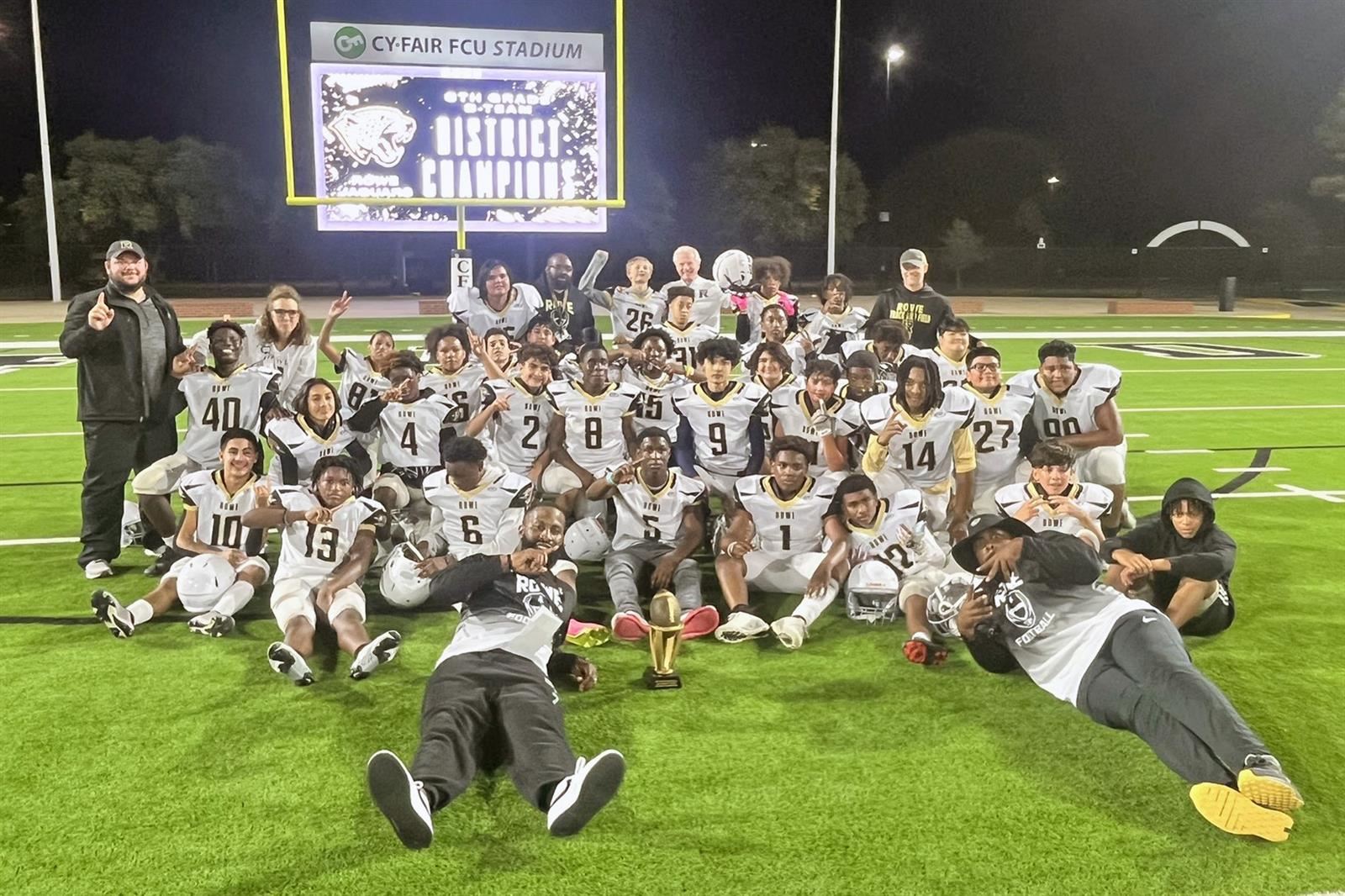 The Rowe 8B football team poses after defeating Hamilton to become the first-ever outright district championship.